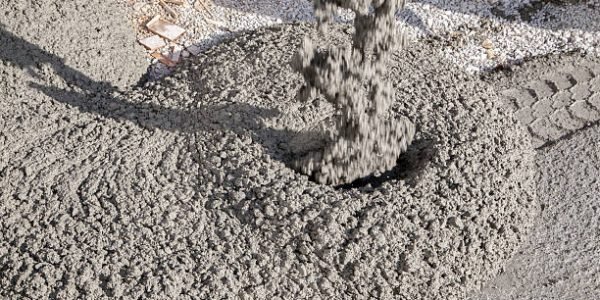 Concrete truck pours concrete to build a floor. Concrete truck pours concrete to build a floor.